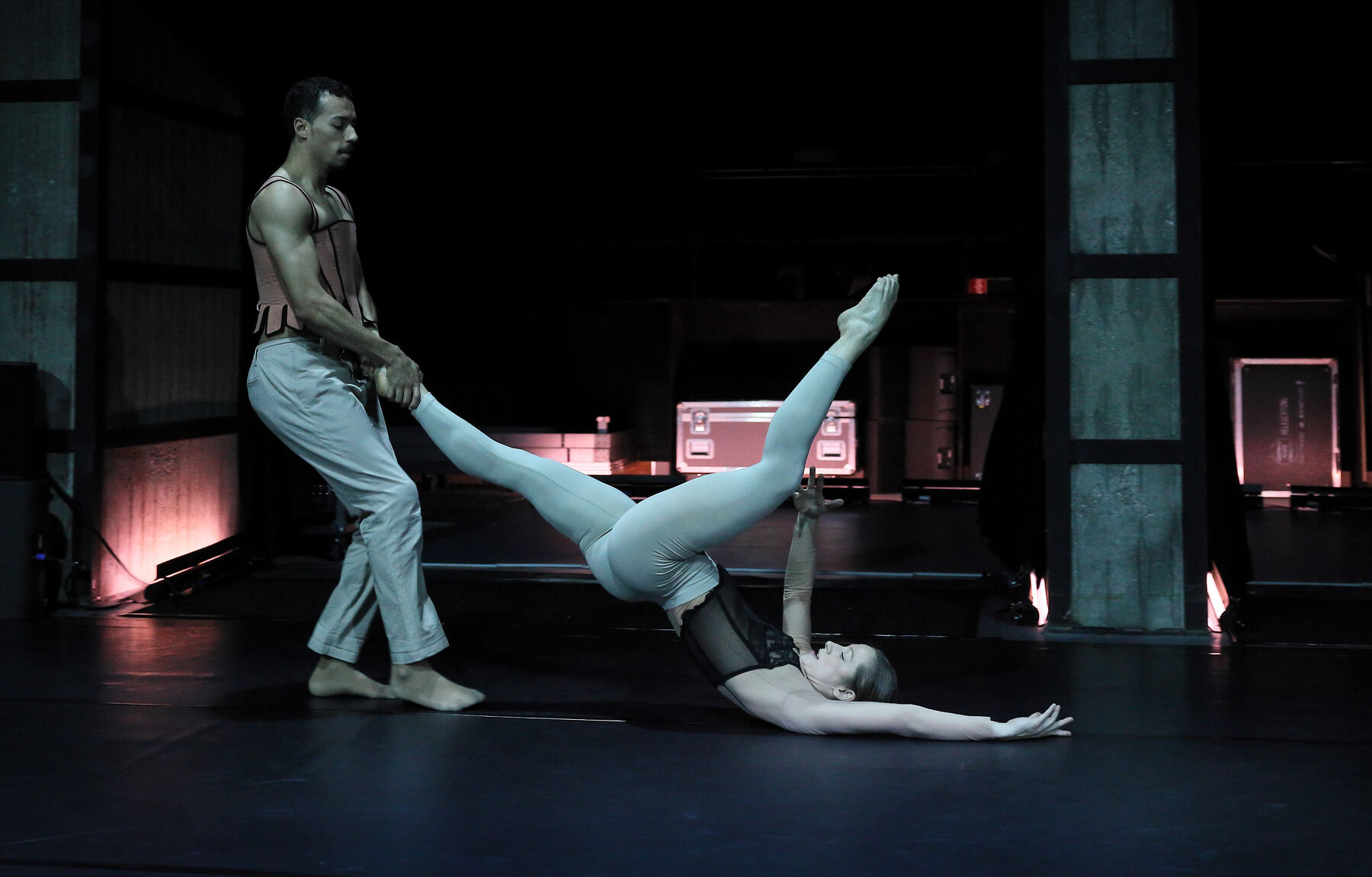 Two dancers are dancing together.